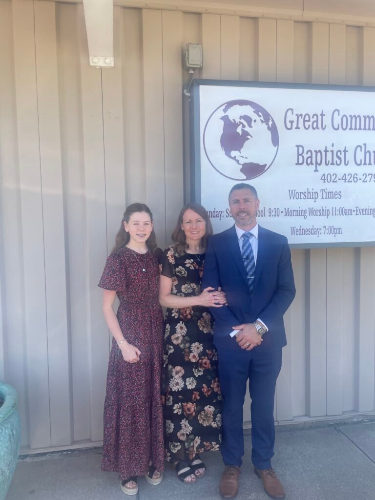 Pastor Burns, his wife and daughter
